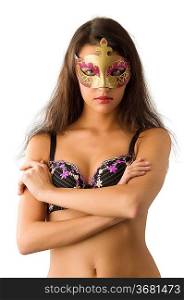 sensual brunette in underwear giving a glace behind carnival mask