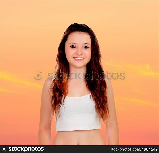 Sensual girl with a orange sky of background