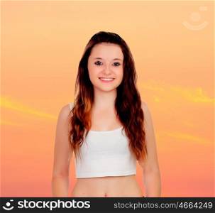 Sensual girl with a orange sky of background