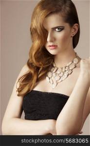sensual girl with long elegant wavy hair-style, cute necklace e dark dress. Perfect skin, fashion style