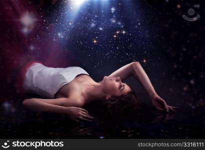 Sensual lady laying over romantic background