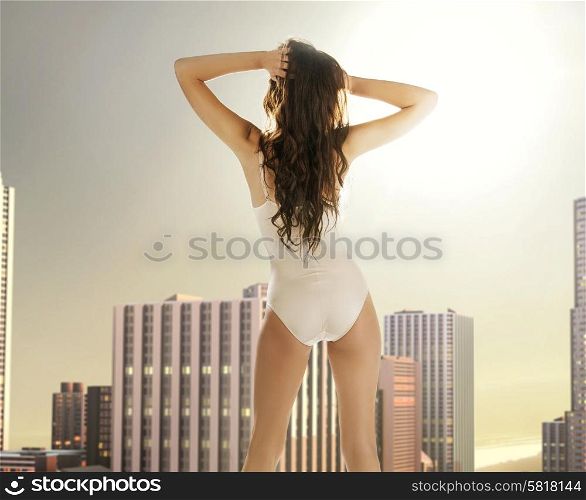 Sensual lady on the terrace of the building