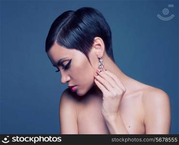 Sensual portrait of a beautiful lady with diamond earring