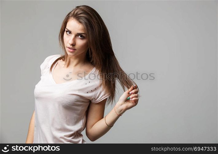 Sensual portrait of beautiful brunette woman posing in studio. Sensual portrait of beautiful brunette woman posing in studio.