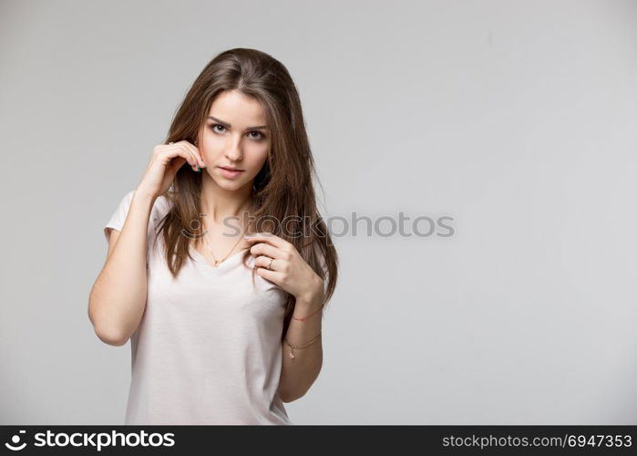 Sensual portrait of beautiful brunette woman posing in studio. Sensual portrait of beautiful brunette woman posing in studio.