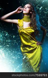 sensual sexy woman in green dress and broken glass