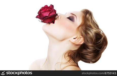 sensual woman with rose in mouth on white background