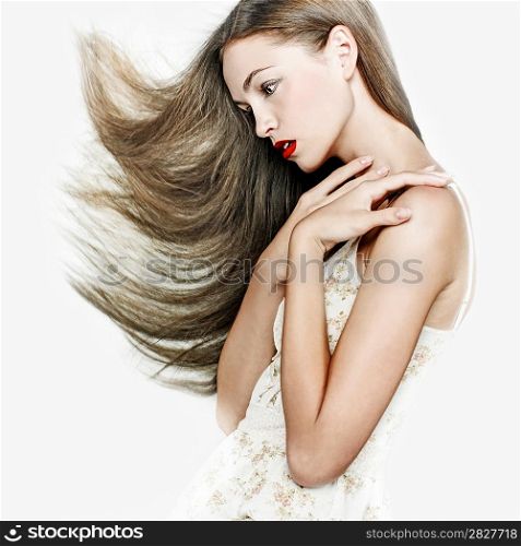 Sensual young woman with beautiful long brown hairs