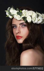Sensuality. Young Brunette wearing Wreath of Roses