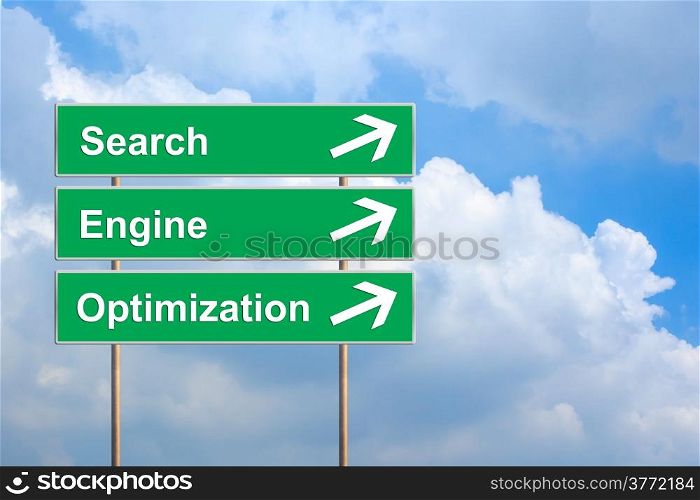 SEO or search engine optimization on green road sign with blue sky