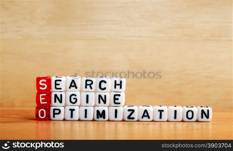 SEO Search Engine Optimization written on dices on wooden background