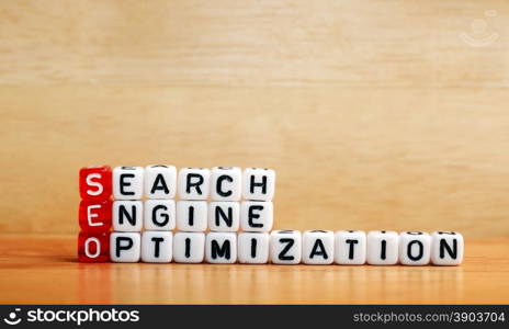 SEO Search Engine Optimization written on dices on wooden background