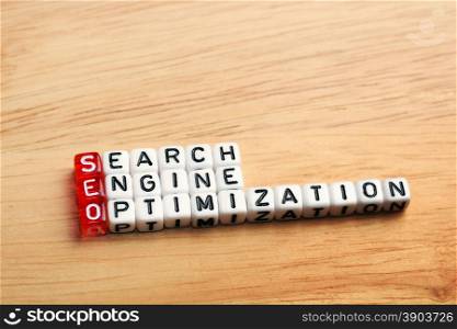 SEO Search Engine Optimization written on dices on wooden background