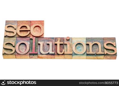 SEO solutions banner in letterpress wood type printing blocks isolated on white