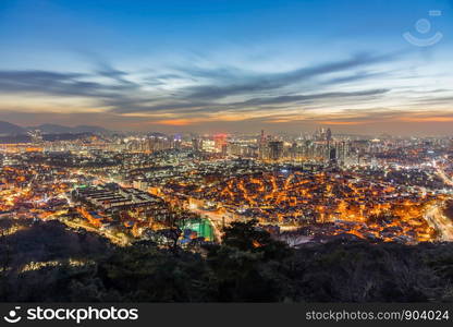 Seoul downtown cityscape illuminated at at night, skyline and skyscraper from Namsan mountain. Seoul, South Korea