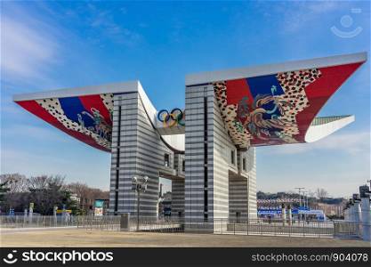 SEOUL, SOUTH KOREA - JANUARY 01, 2019: World Peace Gate is a colorful gate built in Olympic Park as a sign of peace and harmony for the 1988 Seoul Summer Olympics. Clear blue sky background.