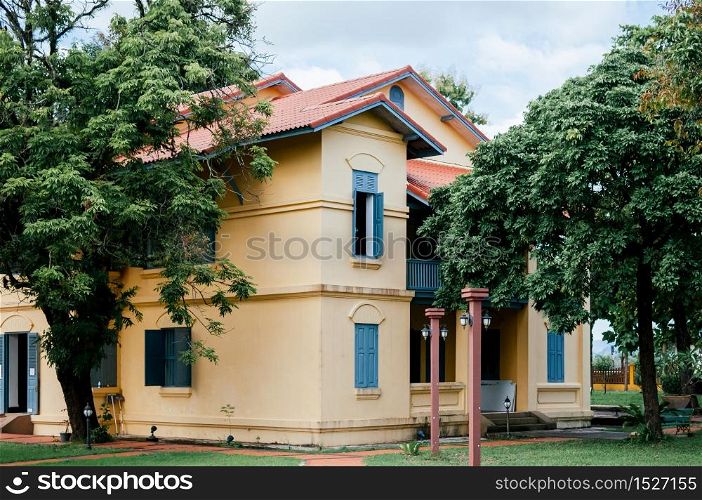 SEP 14, 2012 Nakhon Phanom, Thailand - Nakhon Phanom vintage old Governor house with simple Asian - French colonial architecture style and big tree - Thailand
