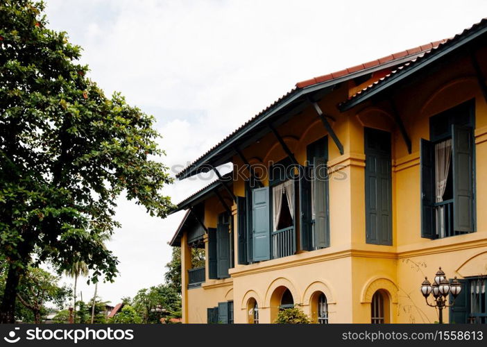 SEP 14, 2012 Nakhon Phanom, Thailand - Nakhon Phanom vintage old Governor house with simple Asian - French colonial architecture style and big tree - Thailand