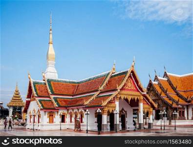 SEP 16, 2012 Sakon Nakhon, Thailand - Grand ancient pagoda and buddha hall of Wat phra that choeng chum, most sacred temple with tourists.