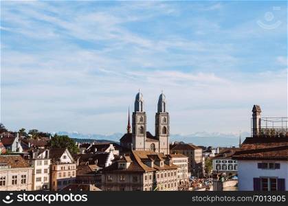 SEP 22, 2013 Zurich, Switzerland - Beautiful old vintage buildings of Grossmunster cathedral and medieval buildings in Zurich Old town Altstadt area