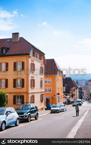 SEP 26, 2013 Neuchatel, Switzerland - Colourful old vintage building and street in La Chaux de Fonds, the most important centre of the Swiss watch making industry