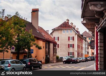 SEP 26, 2013 Neuchatel, Switzerland - Colourful old vintage building and street in La Chaux de Fonds, the most important centre of the Swiss watch making industry