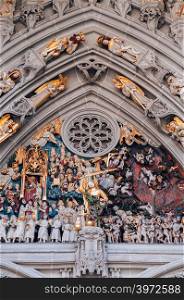 SEP 27, 2013 Bern, Switzerland - Sculptures of the Last Judgement placed over the main portal facade of Evangelical Church, Gothic style facade sculpture.
