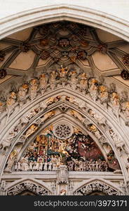 SEP 27, 2013 Bern, Switzerland - Sculptures of the Last Judgement placed over the main portal facade of Evangelical Church, Gothic style facade sculpture.