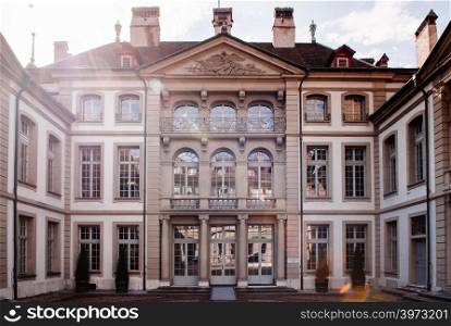 SEP 27, 2103 Bern, Switzerland - Beautiful sunlight over old vinatge building of Erlacherhof Mansion, only Bernese town mansion that has a courtyard.