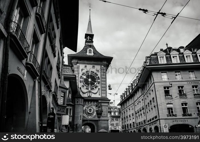 SEP 28, 2013 Bern, Switzerland - Old vintage details of astronomical Zytglogge clock tower. Famous old town area attraction against blue sky