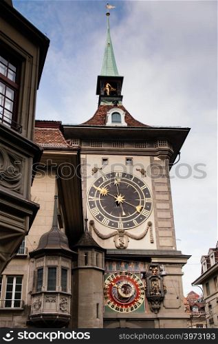 SEP 28, 2013 Bern, Switzerland - Old vintage details of astronomical Zytglogge clock tower. Famous old town area attraction against blue sky