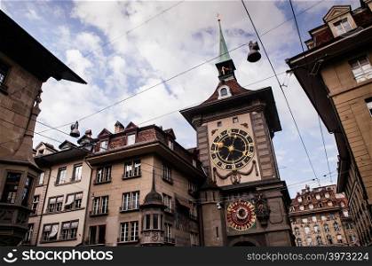 SEP 28, 2013 Bern, Switzerland - Old vintage details of astronomical Zytglogge clock tower. Famous old town area attraction against blue sky