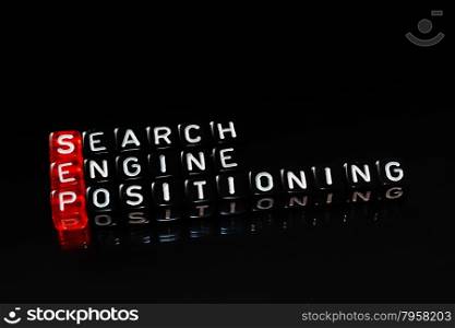 SEP Search Engine Positioning text written on cubes ob black
