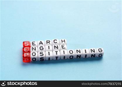 SEP Search Engine Positioning written on cubes on blue