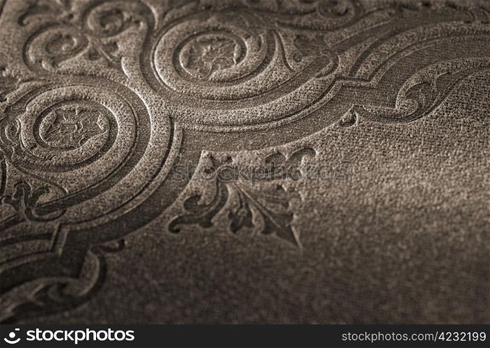 Sepia toned detail of an old book cover (Nya Illustrerade Magazin, printed in 1866)