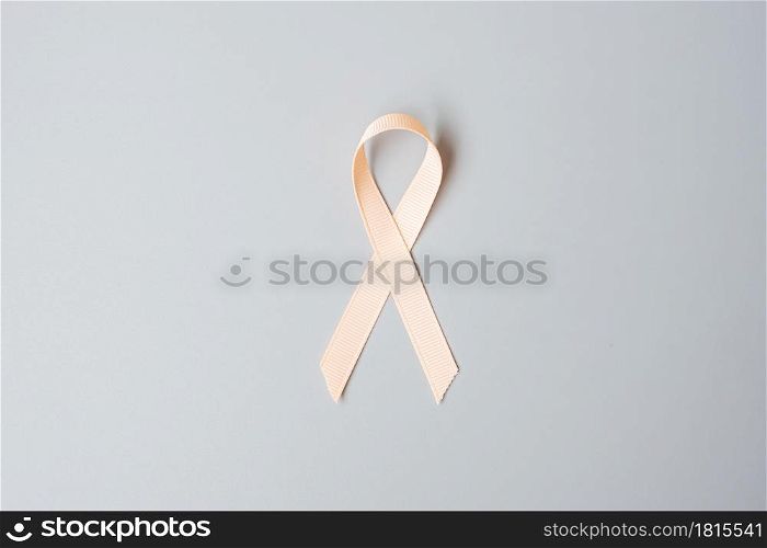 September Uterine Cancer Awareness month, Peach Ribbon for supporting people living and illness. Healthcare and World cancer day concept