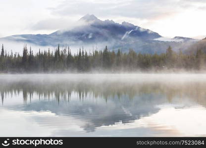 Serene beautiful lake in morning mountains, Oregon, USA.