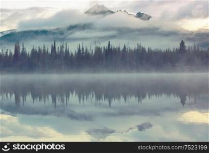 Serene beautiful lake in morning mountains, Oregon, USA.