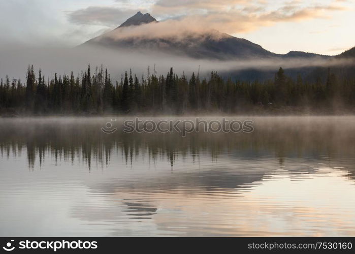 Serene beautiful lake in morning mountains, Oregon, USA.