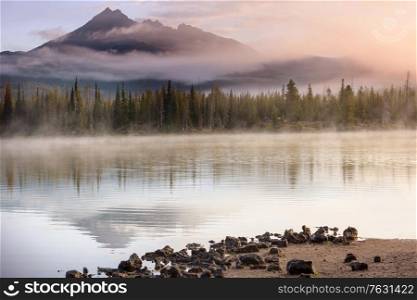 Serene beautiful lake in morning mountains, Oregon, USA.