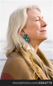 Serene looking gray haired woman