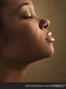 Serene portrait of young adult African-American female&acute;s face.