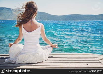 serenity and yoga practicing at the sea