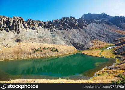 Serenity lake in the mountains in summer season. Beautiful natural landscapes.