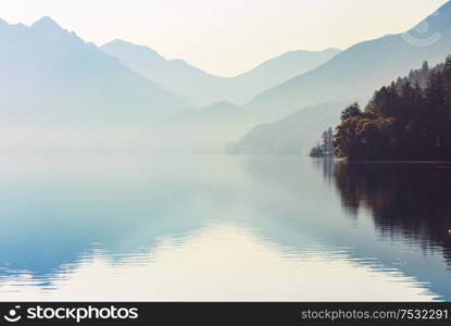 Serenity lake in the mountains in summer season. Beautiful natural landscapes.