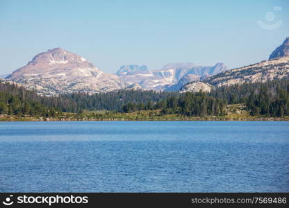 Serenity lake in the mountains in summer season. Beautiful natural landscapes.