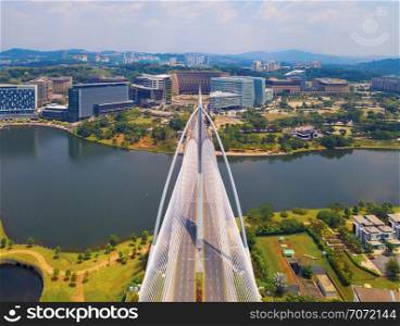 Seri Wawasan Bridge or Putra Bridge and Putrajaya Lake with blue sky. The most famous tourist attraction in Kuala Lumpur City, Malaysia