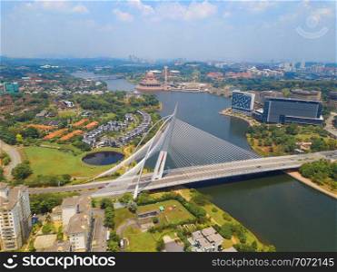 Seri Wawasan Bridge or Putra Bridge and Putrajaya Lake with blue sky. The most famous tourist attraction in Kuala Lumpur City, Malaysia