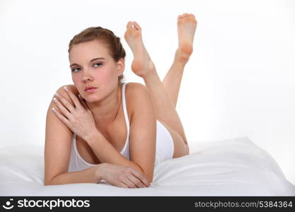 serious beautiful woman on bed