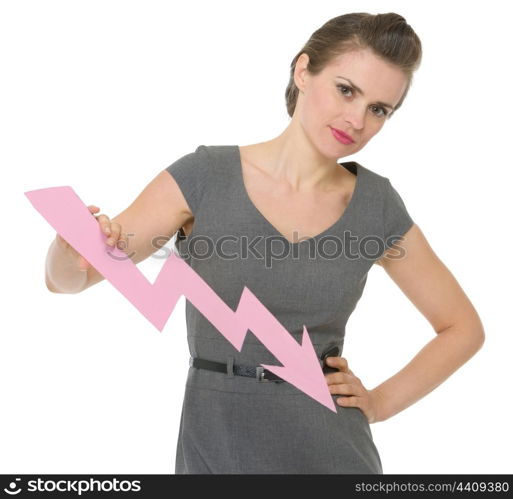 Serious business woman holding decreasing chart arrow . HQ photo. Not oversharpened. Not oversaturated. Serious business woman holding decreasing chart arrow isolated